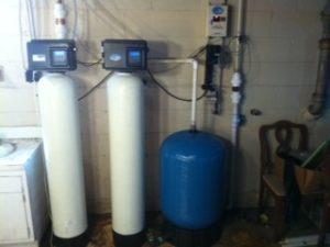 Whole home water treatment system with two softener tanks and a pressure tank, installed by Jones Air & Water
